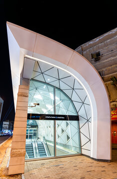 Riyadh, Saudi Arabia - February 20, 2026: The modern illuminated entrance of Al Batha metro station featuring contemporary architectural design and glass facades at night.