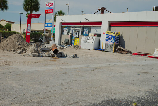 Exxon Gas Station Under Construction With Dirt Piles and Broken Pavement Outside Convenience Store Editorial Use Only St. Pete Beach, FL USA June 10, 2026. rusted pipe, conveying repair work, urban ma