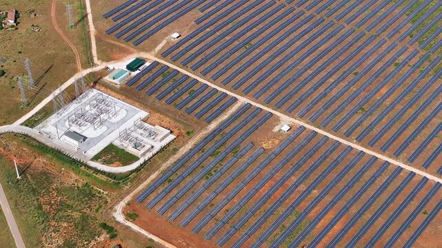 Solar power plant shows photovoltaic panels in rows and clean energy production process on a large scale