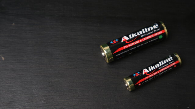 TASIKMALAYA, INDONESIA - JUNE 12, 2026 :Two ABC Alkaline AAA Batteries on a Black Background