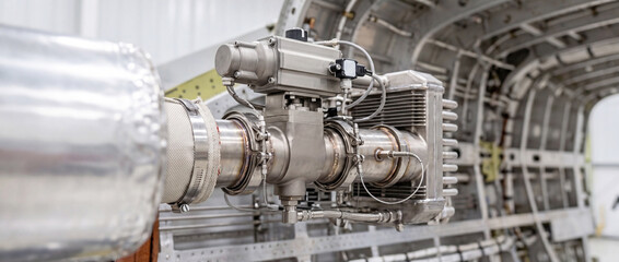 Obraz premium Aircraft engine component installed inside fuselage during aerospace maintenance and inspection