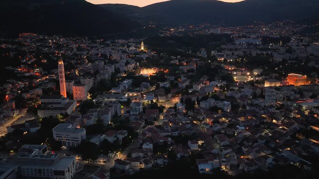 Mostar, Bosnia and Herzegovina &ndash; June 7, 2026: Panoramic aerial night view of Mostar illuminated along the Neretva River valley