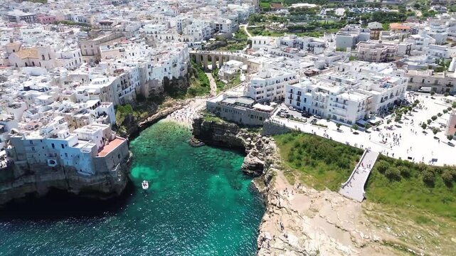 Aerial View of Lama Monachile Beach, Boats and Cliffs in Polignano a Mare, Italy