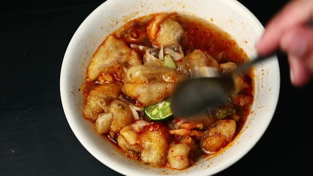 Traditional Indonesian Spicy Meatball Soup Called Basreng Kuah Served in a Bowl
