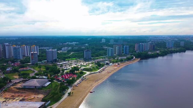 Aerial View of Ponta Negra Beach with Manaus City Skyline in the Background