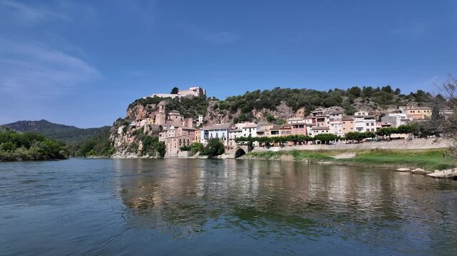 Miravet village and templar castle perched on a hill above the ebro river