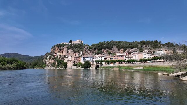 Miravet village and templar castle perched on a hill above the ebro river
