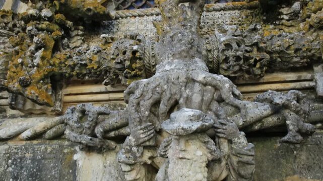 Tomar, Portugal - August 10, 2017: details of Chapter window, Janela do Capitulo, in Manueline style of Diogo de Arruda. Convent of Christ in Templar Castle. Unesco Heritage. Architecture background.