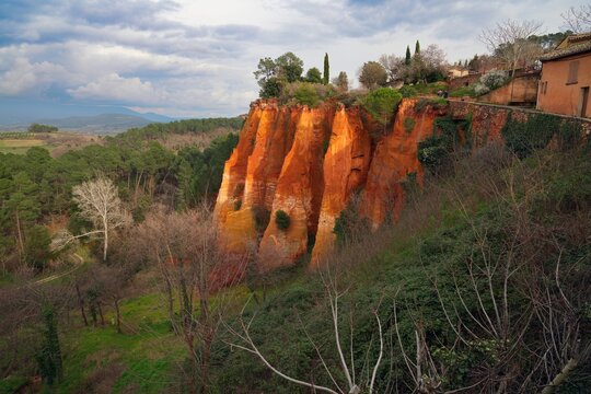 View of red and yellow ochre cliffs outside the town of Roussillon in Vaucluse, Provence, France