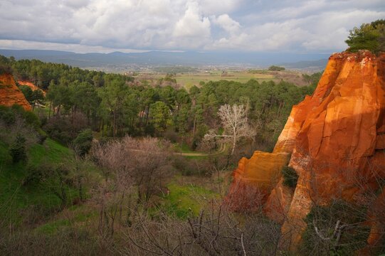 View of red and yellow ochre cliffs outside the town of Roussillon in Vaucluse, Provence, France