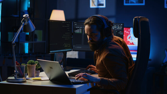Fatigued developer working overnight at home, rubbing eyes while taking break from coding, feeling sleepy. Tired IT admin exhausted from too much screen time, pausing tasks to rest, camera A.