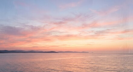 Fototapeta premium Serene Ocean Sunset with Pastel Hues and Gentle Waves.