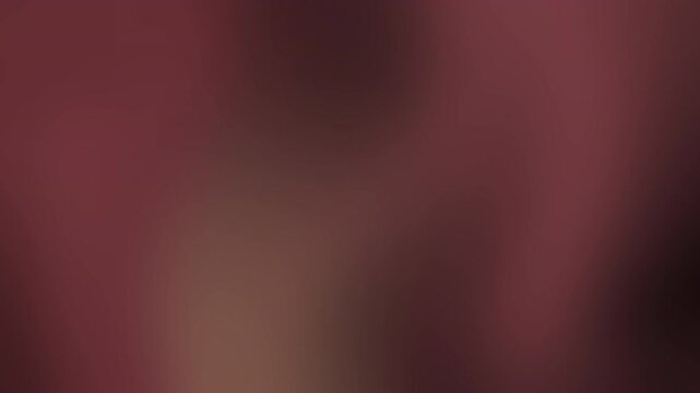 A blurred deep maroon and brownish gradient backdrop with soft lighting