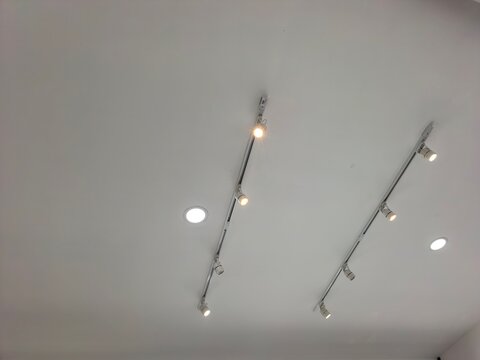 Modern ceiling with track lighting and recessed spotlights illuminating the space