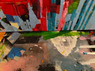 Fototapeta premium Colorful abstract canvas wall and painted floor, red blue green mixed media studio 