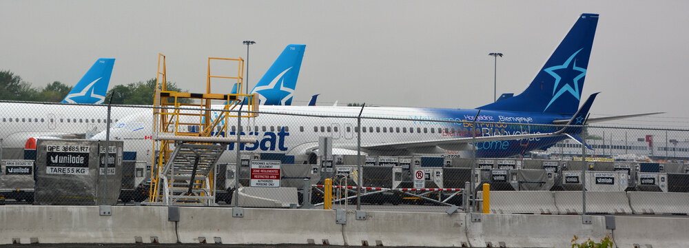 MONTREAL QUEBEC CANADA 06 02 2020:  Air Transat aircraft are parked at the runway of Montreal Dorval  Airport with turbines sealed for a longer rest as a result of the corona pandemic.