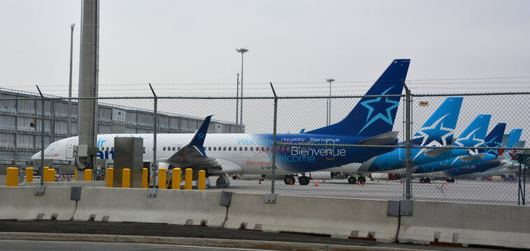 MONTREAL QUEBEC CANADA 06 02 2020:  Air Transat aircraft are parked at the runway of Montreal Dorval  Airport with turbines sealed for a longer rest as a result of the corona pandemic.