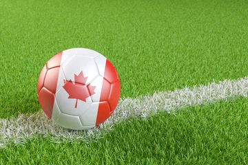 Football / soccer ball with a flag overlay of Canada match and national team of Canada concept © Andreas Prott