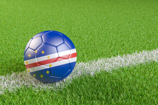 Football / soccer ball with a flag overlay of Cape Verde on a football pitch background. International match and national team of Cape Verde concept