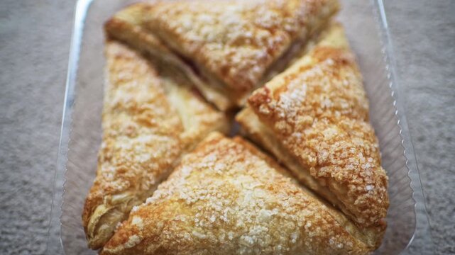 Apple turnover puff pastry pie sugar crust of sweet dessert macro closeup homemade food of many pieces
