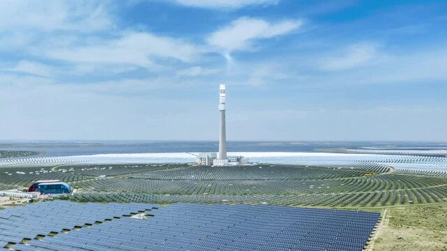 Aerial time-lapse of large-scale tower concentrated solar power plant in Gonghe County, Qinghai Province, China. ﻿