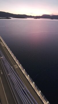 FPV drone perspective sweeping past the massive pillars of the Peljeski Most landmark. High-angle dynamic footage of contemporary civil engineering in the Balkans.
