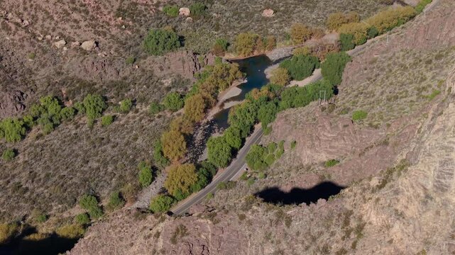 Drone Aerial High Angle on Scenic Mountain Road Next to River in Rugged Valley of San Rafael Mendoza Argentina