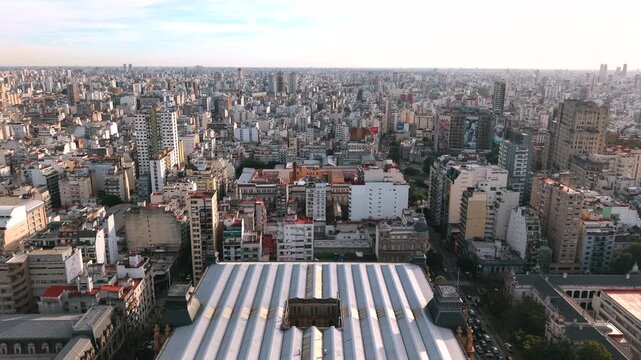 Tribunales district surrounds Plaza Lavalle in central Buenos Aires, Argentina, revealing dense urban blocks, civic architecture and commercial development, drone slow forward flyover shot.