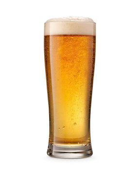 Tall glass of golden beer with frothy head and bubbles isolated on transparent background
