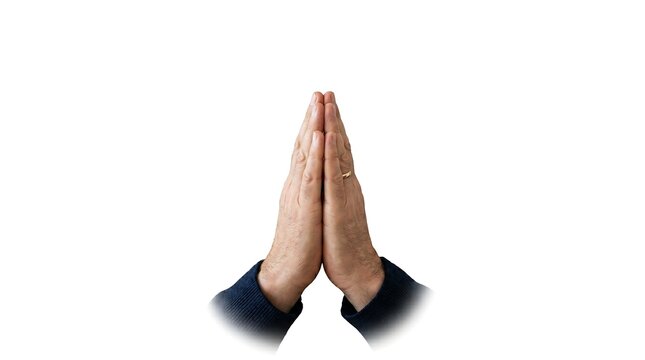 Close up of a man's hands pressed together in a prayer or namaste gesture isolated on a white background.