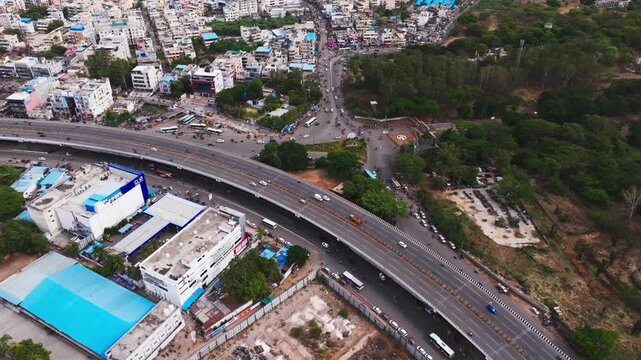 BHEL Junction with bhel flyover, moving vehicles, buildings, trees and BHEL parking area at Lingampally, Tara Nagar, Chanda Nagar, Hyderabad, Telangana, india. day time, stable shot, drone shot, 4k.