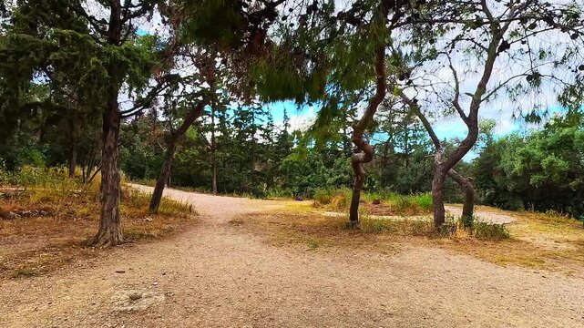 Philopappou Hill in Athens, Greece park point of view pov hiking trail walking in spring summer with mediterranean landscape