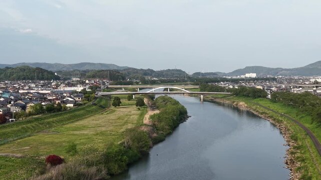 SHIBATA, JAPAN.Riverside sakura landscape April 28 2026