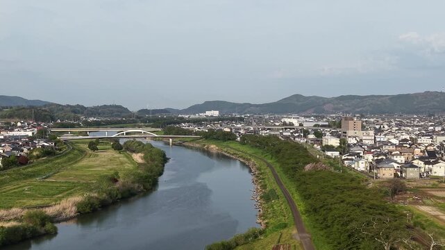 SHIBATA, JAPAN.Riverside sakura landscape April 28 2026