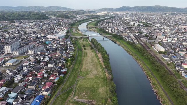 SHIBATA, JAPAN.Riverside sakura landscape April 28 2026