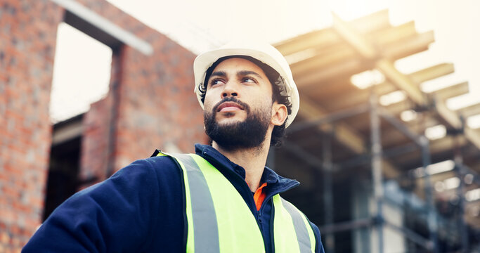 Man, engineer and low angle with thinking in city, helmet and urban solution at construction site. Person, architect and perspective for project with infrastructure inspection and decision in Mexico
