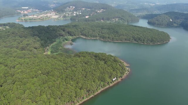 Lateral Drone Flight Over Pine Hill Revealing Inlets of Tuyen Lam Lake in Da Lat, Vietnam