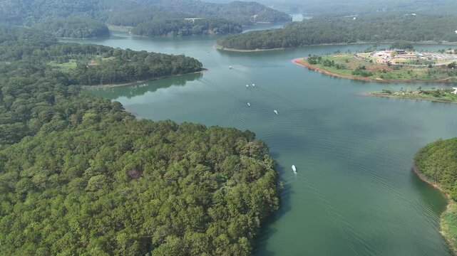 Drone Flight Over Tuyen Lam Lake With Tourist Boats and Lakeside Resort in Da Lat, Vietnam