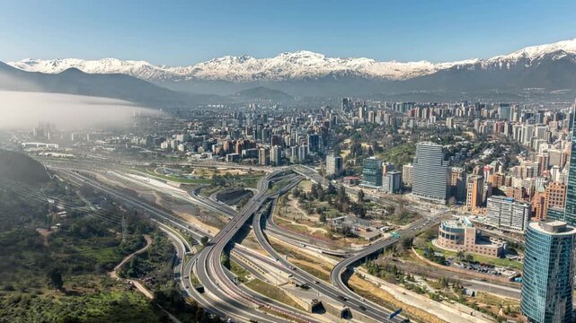 Santiago, Chile. Aerial view with the Andes mountain range in the background. Mountain range and snow-capped mountains.