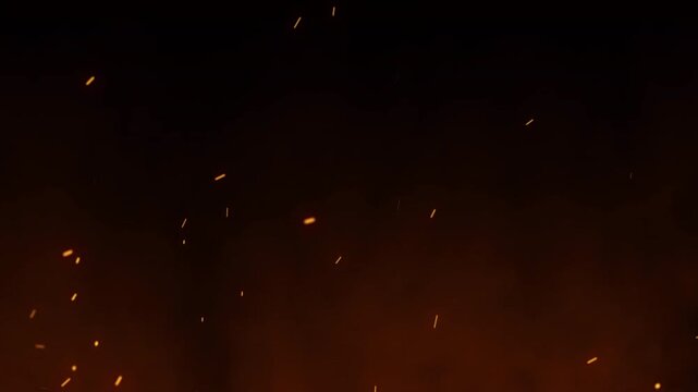 Hot burning fire sparks and ashes motion in a fiery atmosphere. Bright glowing fire particles rising background  for cinematic video overlays and motion graphics background.