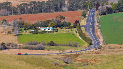 Naklejka premium Aerial View of Winding Rural Highway and Farmland in Dorrigo