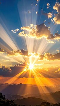 Stunning sun rays pierce through dramatic clouds over a mountain landscape at sunset.