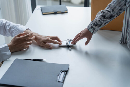 Asian office worker informs HR of resignation