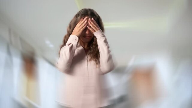 Woman Feeling Dizzy And Holding Her Head