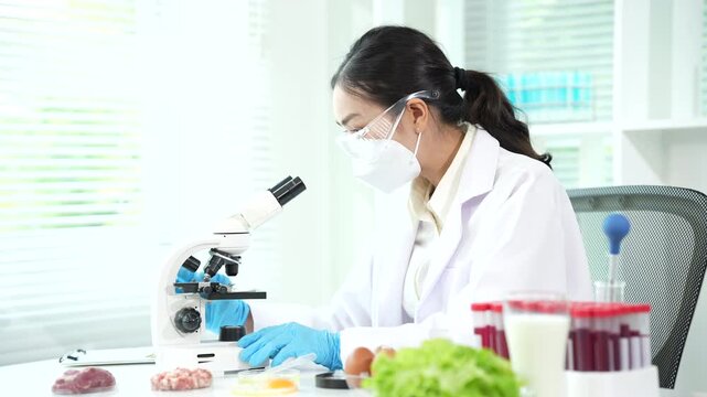 Scientist conducting food safety analysis on egg samples in a laboratory, using microbiological testing and quality control procedures to ensure food quality and consumer protection.