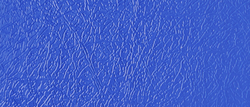 Cobalt blue leather texture background, vibrant faux leather material with pebble grain pattern, synthetic blue skin surface for upholstery