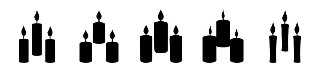Black candles in different quantities on a flat surface - Minimalist vector illustration showing black candles grouped in various quantities standing upright on a plain surface. © Tanjila