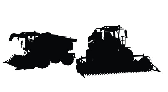 silhouette of tractor and harvester machines in field