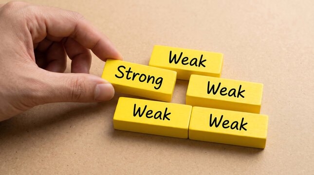Business concept, strong and weak blocks, leadership, teamwork, strategy