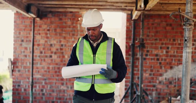 Walking, black man and blueprint on construction site for inspection, infrastructure and property. Architecture, civil engineering and worker for building safety, renovation and remodeling project